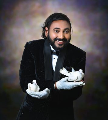 Magician Vasanth with pigeons on his two hands