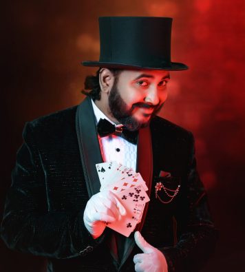 Magician vasanth performing magic with playing cards