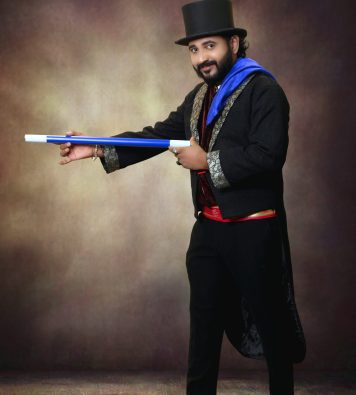 Magician vasanth performing magic with single stick