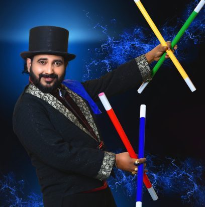 Magician vasanth performing magic with different color sticks